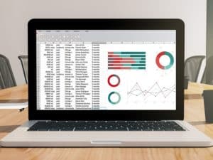 Laptop on a conference room desk. Using Google Sheets for business purposes